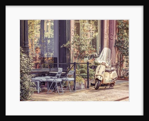 Scooter parked by street cafe by Assaf Frank